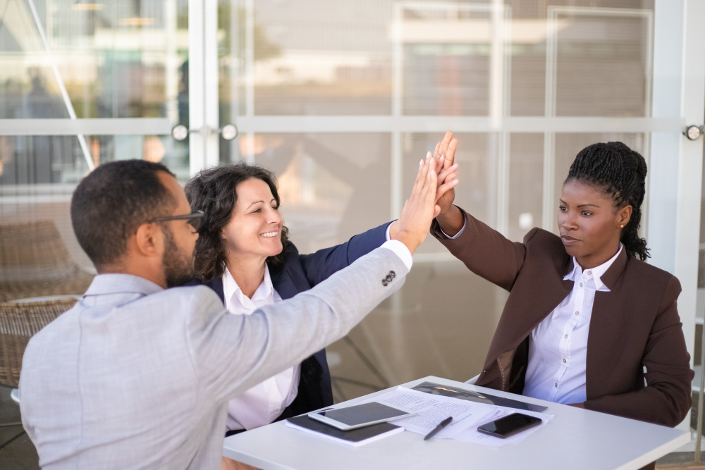 Happy businesspeople celebrating team success